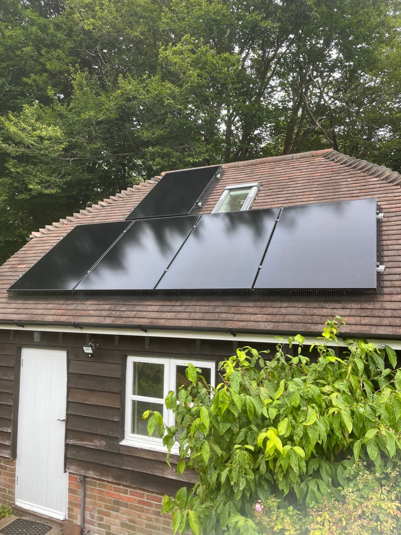 All-black solar PV panels on a tiled roof
